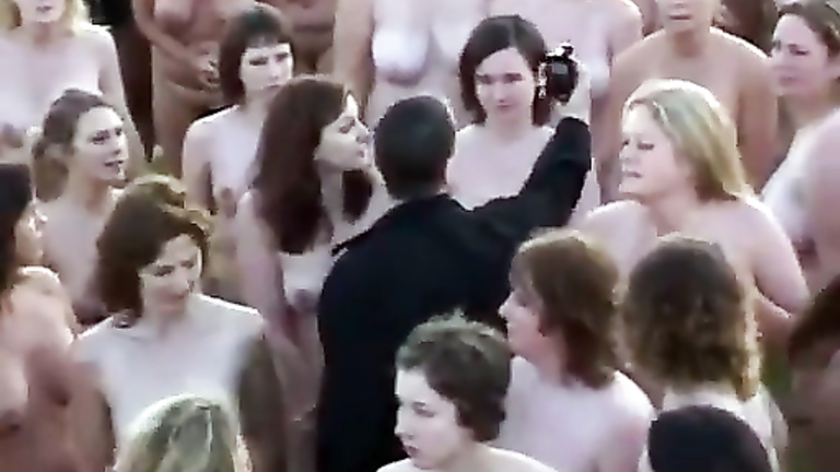 Hundreds of nudists strip for a camera man