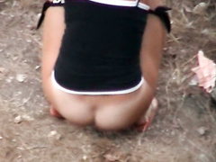 Voyeur pissing video of brunette in the woods