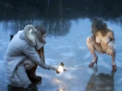 Russian beauty in heels peeing on frozen lake