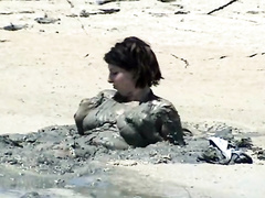 Curvy girl gets naked and plays in the mud