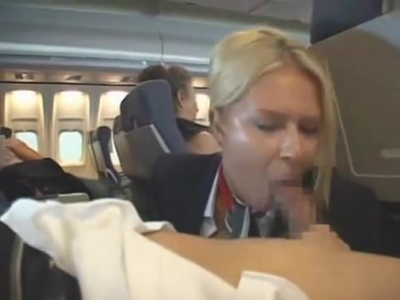 Busty blonde stewardess sucks a passenger off on the plane voyeurstyle