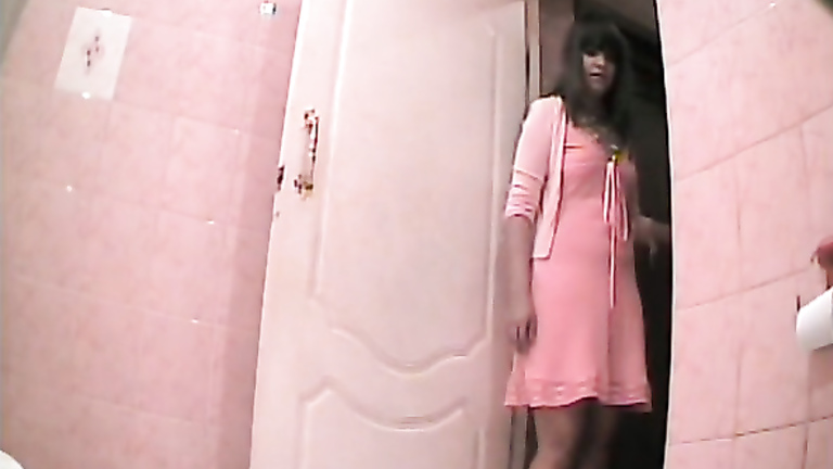 Pretty girl in pink dress takes a long piss