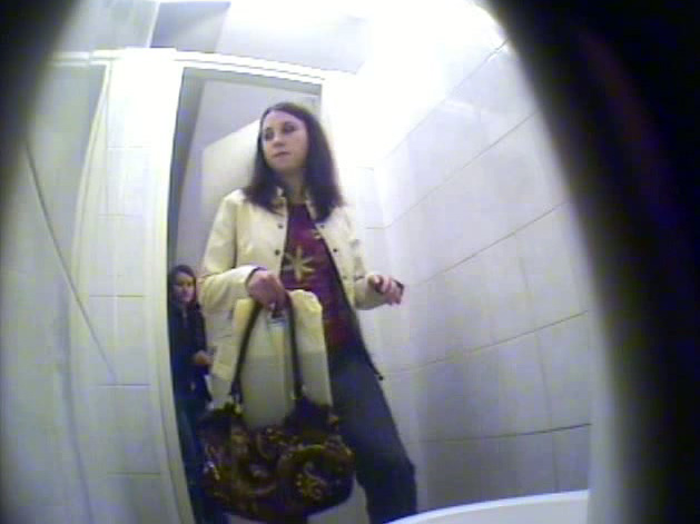 Cute babe filmed pissing by a toilet voyeur