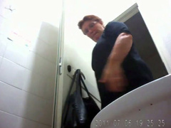Mature mom urinates with the toilet door wide open