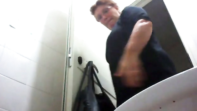 Mature mom urinates with the toilet door wide open