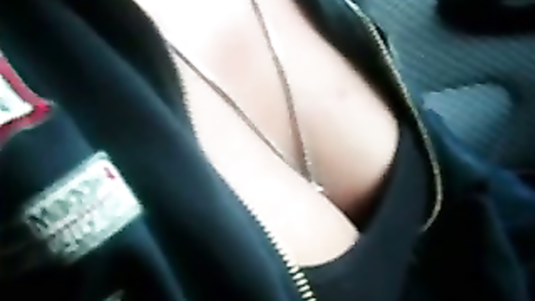 Playing with her amazing titties in the car