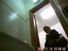 Classy blonde mature urinates in public bathroom video