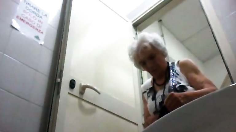 Charming granny in pantyhose pisses and wipes clean