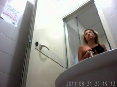 Two blondes take long piss in public restroom video