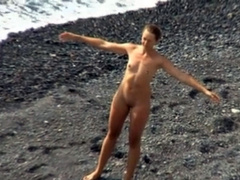 Small tits girl is naked and sexy on the beach