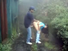 Couple fucks outdoors on a stormy day