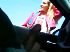 Street hooker reaches into the car and gives a handjob