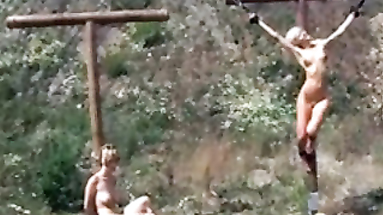 Skinny slave girls in outdoor crucifixion video clip