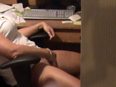 Secretary is filmed masturbating to erotic video at work