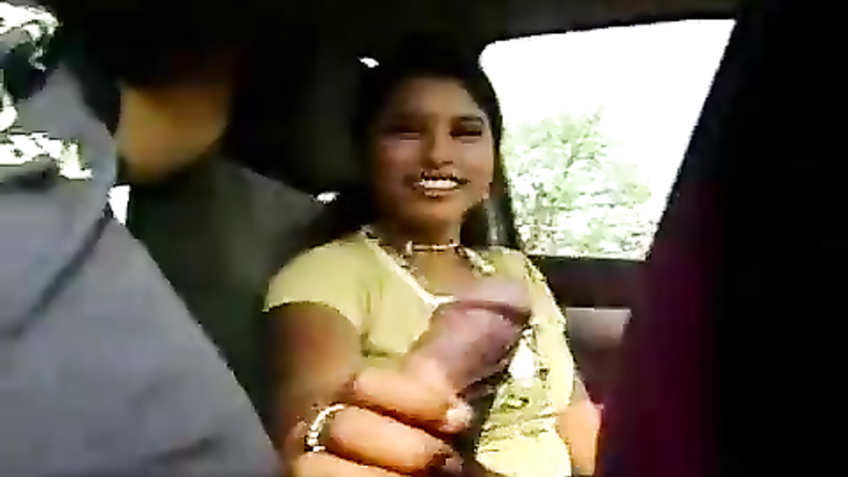 Latina amateur gives a handjob in the car