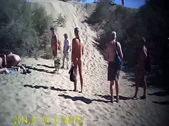 French swingers fuck on the nude beach as people watch
