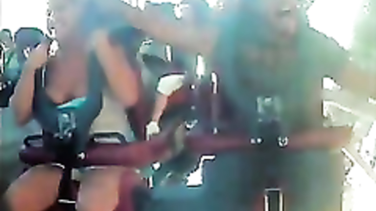 Amateur tits pop out during a roller coaster ride. 