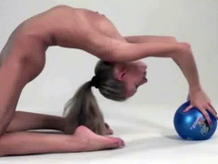 Naked gymnast bends her body in breathtaking ways