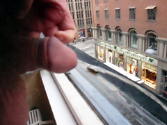 Dude pissing out his apartment window