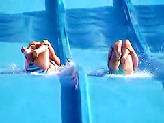 Tiny tits and ass exposed on the waterslide