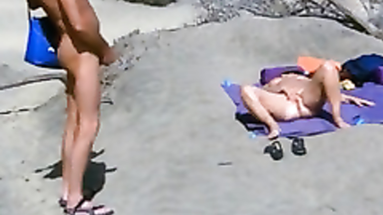 Girl masterbating on beach