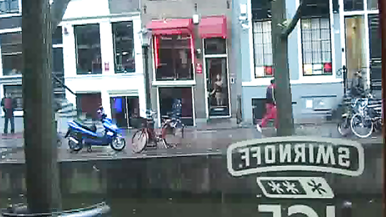 Amsterdam prostitutes tease in the windows