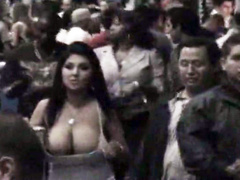 Giant boobs spill out of a top in public