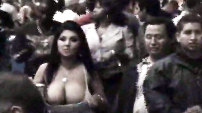 Giant boobs spill out of a top in public | voyeurstyle