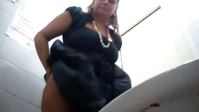 Pregnant woman squats and pees over public toilet