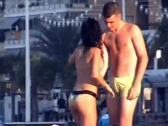 Italian girl fingered hard on the public beach