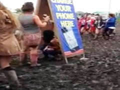 Hippie girl peeing in the mud at concert