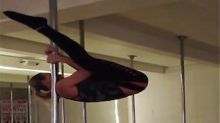 Blonde sweetheart practices her pole skills