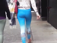 Blue spandex hugs her ass on the city street