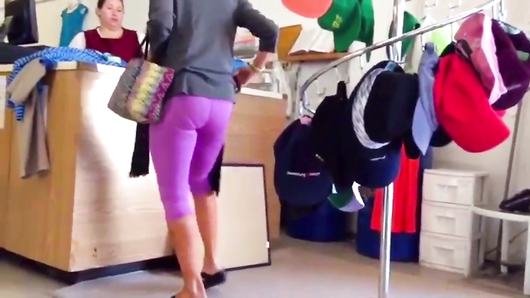 Blonde shopaholic in pink sweatpants gets her behind taped