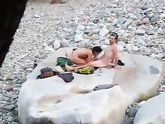 Slim brunette honey enjoys blowing a dick at the beach