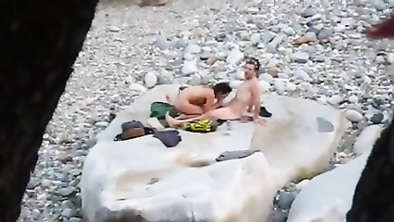 Slim brunette honey enjoys blowing a dick at the beach