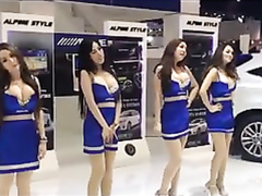 Busty babes dancing at the car fair