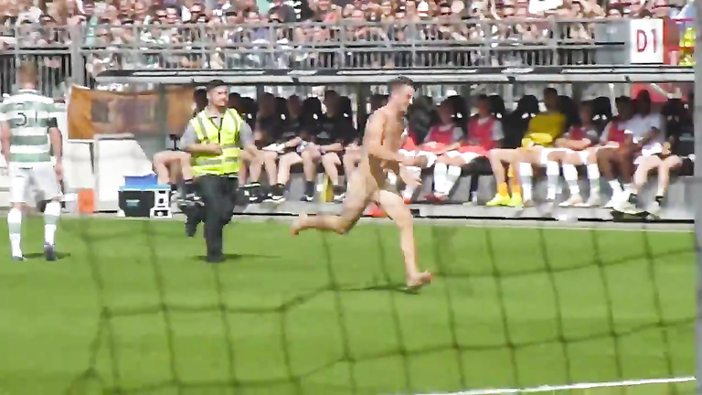 Nude maniac runs around the football field