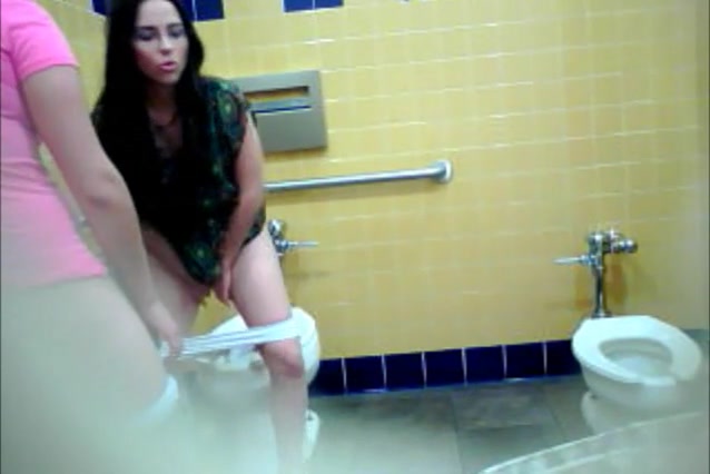 Girl gets caught on camera pissing in the public toilet
