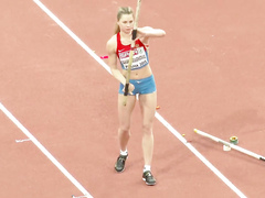 Pole vaulter with a nice butt competes in an event