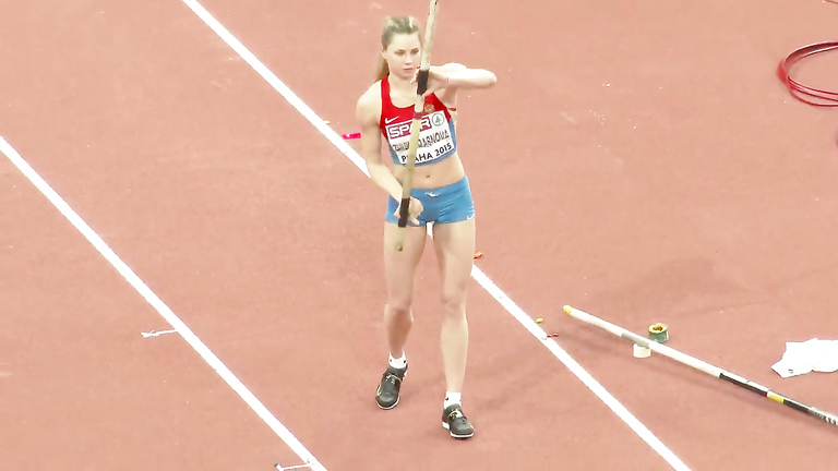 Pole vaulter with a nice butt competes in an event