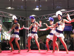 Sexy girls in short skirts dancing for the crowd