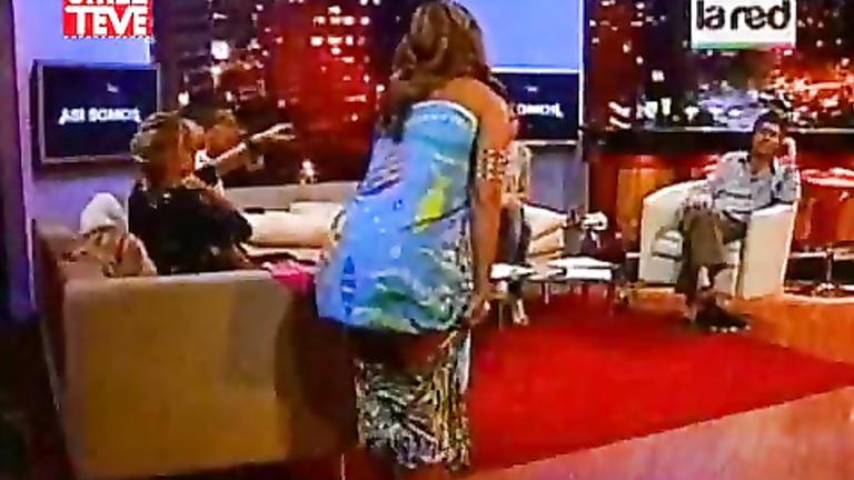 Great-looking television anchorwoman changes her clothes in the studio