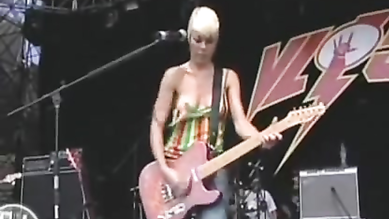 Blonde guitarist exposes her cute boob