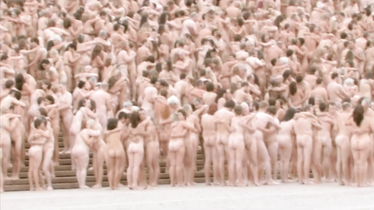 Thousands of people pose completely naked for an art creation
