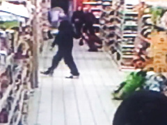 Impudent brunette urinates in the middle of the supermarket floor