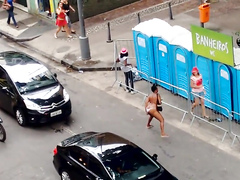Shameless Brazilian woman urinates in the middle of the road