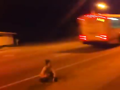 Graceful brunette takes a leak on the highway