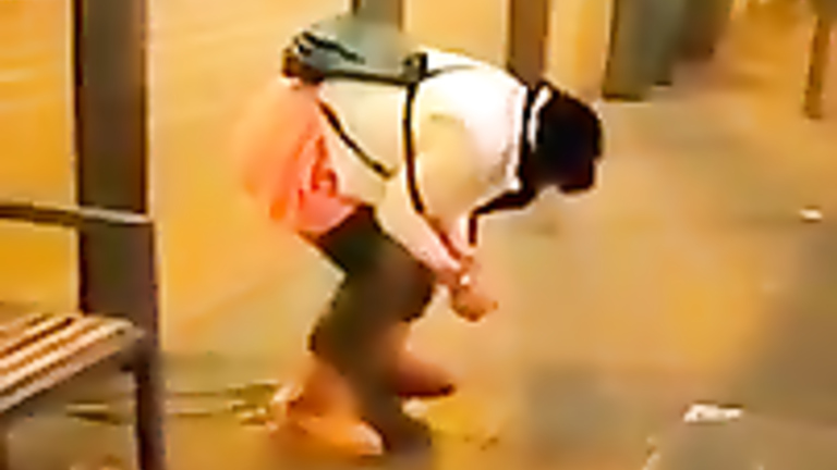 Wicked homeless woman urinates at the crowded place