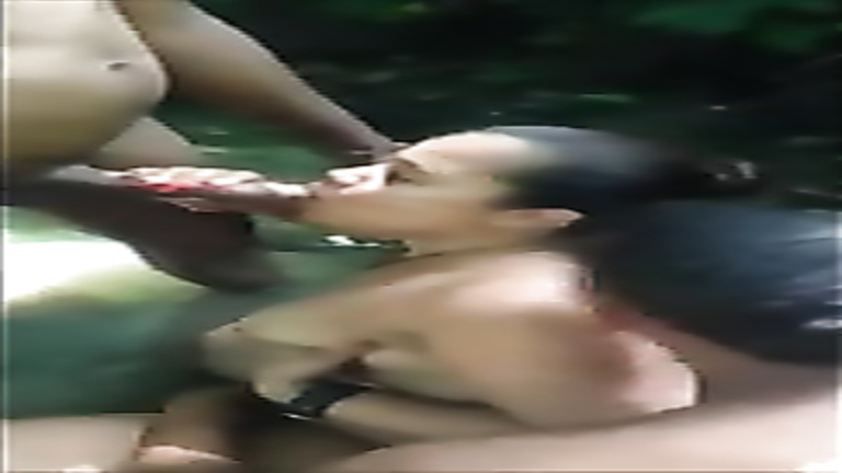 Brazilian prostitute enjoys sucking hard on two throbbing penises